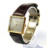 LONGINES, A VINTAGE 9CT GOLD GENT'S WRISTWATCH Square form with champagne dial and gilt hands, on
