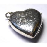 A STERLING SILVER HEART FORM VESTA CASE Having engraved decoration, hallmarked 'Sterling'. (approx