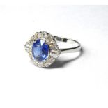 AN 18CT WHITE GOLD SAPPHIRE AND DIAMOND RING oval cut Sri Lanka sapphire edged with baguette and