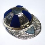 A STERLING SILVER NOVELTY JOCKEY CAP OVAL PIN CUSHION Set with blue velvet cushion, marked '