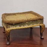 A REGENCY PARCEL GILT STOOL On carved cabriole legs, stamped to underneath, English, Circa 1820. (