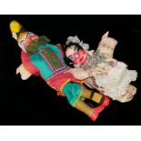 PUNCH AND JUDY, A VINTAGE PAIR OF CARVED WOODEN HAND PUPPETS With wooden head, legs and fabric