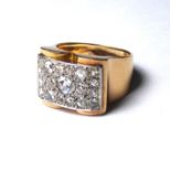 AN 18CT GOLD AND ROSE CUT DIAMOND RING An arrangement of round cut diamonds in a wide band design