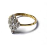 A 9CT GOLD AND DIAMOND RING The arrangement of diamonds forming a lozenge design (size O). (approx