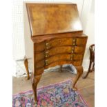 AN EARLY 20TH CENTURY QUEEN ANNE REVIVAL WALNUT BUREAU The fitted interior above three inverted
