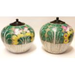 A PAIR OF 19TH CENTURY CHINESE FAMILLE VERTE GINGER JARS Spherical form with turned wooden covers,