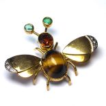 AN 18CT GOLD, DIAMOND AND GEM SET BEETLE BROOCH Tiger's Eye stone in centre with oval cut citrine,
