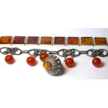 A VINTAGE CONTINENTAL SILVER AND AMBER BRACELET Set with square amber panels, together with a