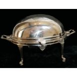 A VICTORIAN SILVER PLATED BREAKFAST DISH Having a dome form top with ivory handle, twin handles cast