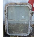 A CAST ALUMINIUM RECTANGULAR SHIP'S PORTHOLE. (53cm x 70cm)