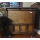 AN ORIENTAL STAINED PINE AND OAK PANELLED SIDE CABINET With rising lift off lid.