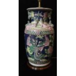 A 20TH CENTURY CHINESE PORCELAIN LAMP Famille rose pallet on a blue ground with Salamanca handles,