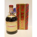 DRAMBUIE, A VINTAGE BOTTLE OF WHISKEY LIQUEUR 1 Litre bottle with red seal and outer tartan box