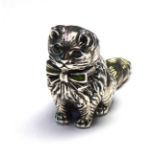 A STERLING SILVER NOVELTY MODEL OF A CAT Seated pose with glass set eyes and bowtie. (approx 3cm x