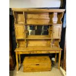 A 19TH CENTURY AND LATER WAXED PINE KITCHEN DRESSER The super structure having a mirror back and