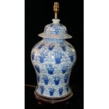 A LARGE CHINESE BLUE AND WHITE BALUSTER VASE AND COVER Converted to a table lamp, with cream