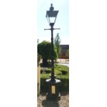 A VICTORIAN STYLE CAST IRON AND COMPOSITION LAMP POST With Westminster style lantern above T-bar