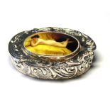 A STERLING SILVER AND ENAMEL OVAL PATCH BOX The scrolled floral case with recumbent nude maiden to