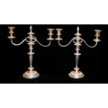 GARRARDS, A PAIR OF EARLY 20TH CENTURY SILVER PLATED CANDELABRA Having twin scroll arms, embossed