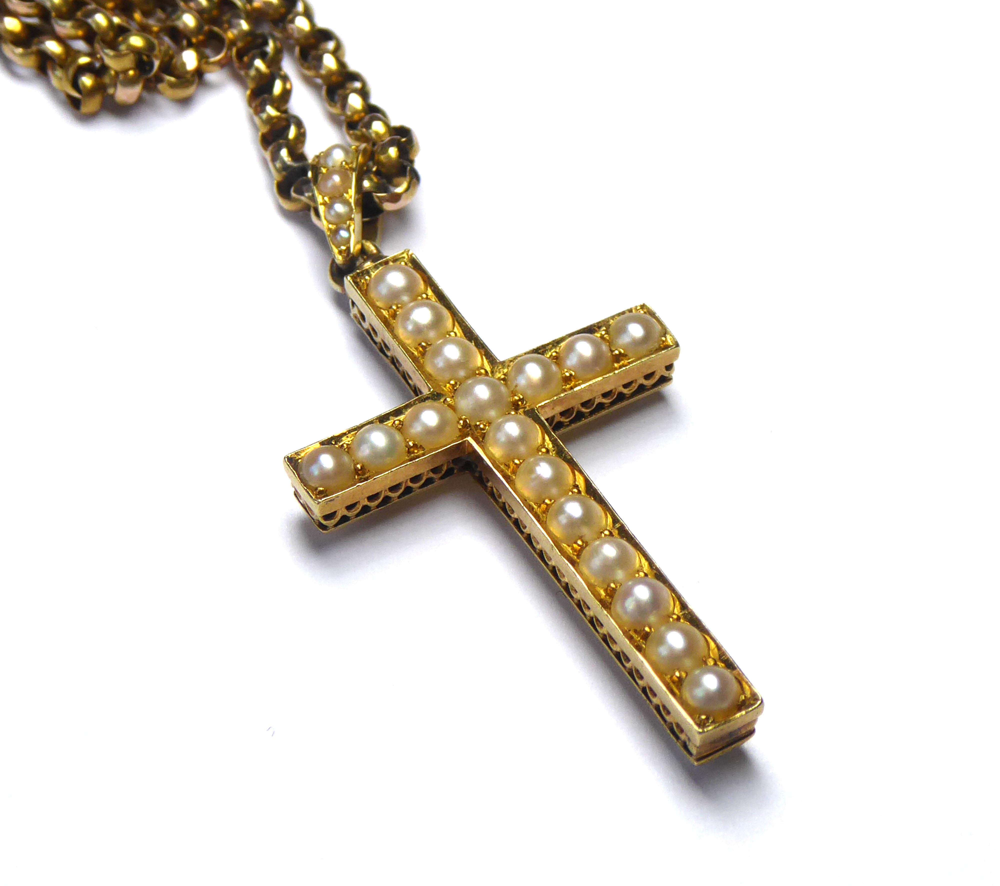 A VICTORIAN YELLOW METAL AND SEED PEARL CRUCIFIX WITH 9CT GOLD NECKLACE The single row of seed