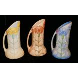 THREE ART DECO BURLEIGH WARE JUGS With floral decoration. (22cm)