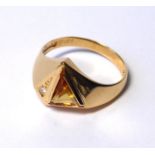 AN 18CT GOLD, CITRINE AND DIAMOND RING The trillion cut citrine with a round cut diamond (size