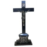 A 19th CENTURY WHITE METAL AND EBONISED WOOD CRUCIFIX, having an applied white metal plaque to
