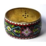 AN EARLY 20th CENTURY CHINESE CLOISONNÉ BANGLE, wide form with floral decoration on black ground.