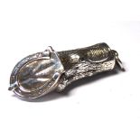 A STERLING SILVER NOVELTY HORSE HOOF VESTA CASE Having a hinged horseshoe and strike to base. (