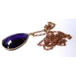 A LARGE 18CT GOLD AND AMETHYST PENDANT AND 9ct ROSE GOLD NECKLACE. a pear form faceted amethyst in