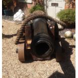 A FULL SIZE 17TH CENTURY DESIGN NAVAL REENACTMENT COMPOSITE CANNON On wooden base with iron work and