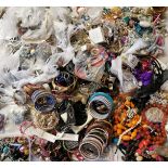 A LARGE QUANTITY OF COSTUME JEWELLERY Mainly bangles faux pearls etc.