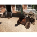 A FULL SIZE 17TH CENTURY DESIGN NAVAL REENACTMENT COMPOSITE CANNON On wooden base with iron work and
