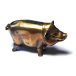 A BRASS PIG FORM VESTA CASE Standing pose with hinged head and strike to base. (approx 6cm)