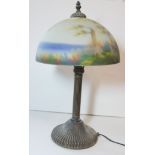 AFTER DAUM NANCY, A MUSHROOM TABLE LAMP The glass shade decorated with a landscape, raised on a