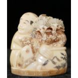 A 19th CENTURY JAPANESE MEIJI CARVED IVORY NETSUKE, a Seated gent with bonsai tree Signed red