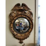 AN ENGLISH CONVEX MIRROR, CIRCA 1810 - 1820 Original plates, retained in a circular ebony reeded