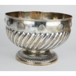 A LARGE SILVER ROSE BOWL Having applied Tudor rose decoration with flutes to circular base,