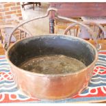 A LARGE 19TH CENTURY HEAVY GAUGE COPPER OVAL CAULDRON With iron swing handle. (52cm)