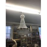 A LARGE BASKET CHANDELIER Brass girdle with masks and foliage. (h 110cm)