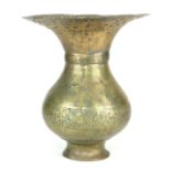 A 12TH CENTURY PERSIAN BRASS VASE Having flared rim with openwork decoration, decorated with