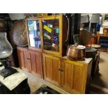 A VICTORIAN PINE HOUSE KEEPER'S CABINET With central glazed doors and enclosed cupboards, in three