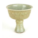 A CHINESE CELADON STEM CUP Raised on a faux bamboo column. (11cm tall)