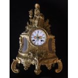 A 19TH CENTURY BRONZE ORMOLU FIGURAL MANTEL CLOCK Having a figure of a young maid with a dove, the