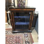 A VICTORIAN AMBOYNA AND EBONISED PIER CABINET Applied with gilt metal mounts, the single glazed door
