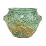 A CHINESE CARVED JADE DRAGON BOWL Raised decoration of opposing dragons chasing a flaming pearl. (
