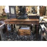 A VICTORIAN MAHOGANY TWO DRAWER SIDE TABLE Having turned handles and reeded legs. (approx 122cm x