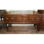 AN ANTIQUE OAK DRESSER With three deep drawers, raised on turned legs with pad feet. (73cm x 67cm