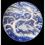 A LARGE JAPANESE IMARI BLUE AND WHITE CHARGER PLATE Hand painted with exotic birds in a stylised