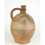 A MID 20TH CENTURY EARTHENWARE ART POTTERY EWER Having stylised floral decoration. (approx 28cm)